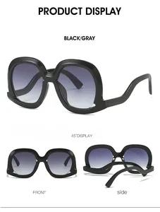 Three-angle view of oversized sunglasses featuring wavy temples and gray gradient lenses