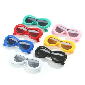 Fashion thick oval sunglasses in seven colors with sleek plastic frames and dark lenses