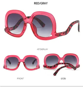 Detailed views of pink transparent square sunglasses with leopard temples and grey lenses