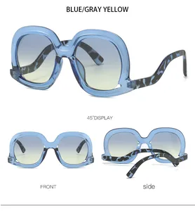 Blue oversized sunglasses with gradient lenses and marble pattern temples shown in three views