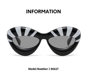 Detailed view of cat eye sunglasses 86627 with black and white striped frame design