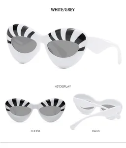 Three views of white cat-eye sunglasses with bold black stripes and grey lenses