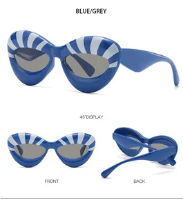 Detailed views of blue cat eye sunglasses with white stripes and grey lenses in multiple angles