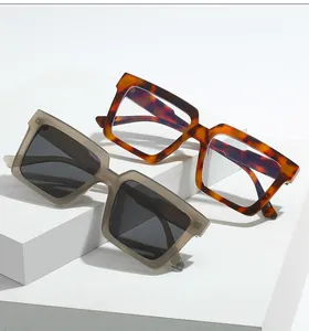 Detail of vintage square glasses with tortoise shell and matte grey translucent frames