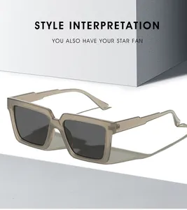 Detail of square vintage sunglasses with translucent grey frames and tiered temples