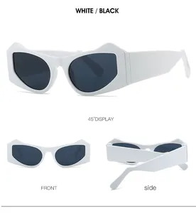 Detail view of white geometric cat-eye sunglasses with thick frames and dark lenses