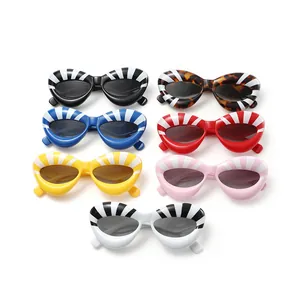 Collection of seven trendy cat-eye striped sunglasses in various vibrant colors