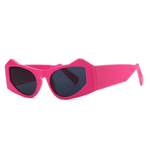 Trendy hot pink cat-eye sunglasses with thick geometric frames and dark lenses