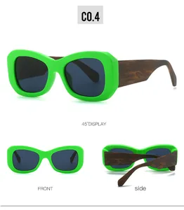Detailansicht der neongrünen Fassung mit braunen Holzeffekt-Bügeln bei dieser Sonnenbrille