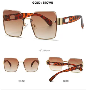 Detailansicht der quadratischen randlosen Sonnenbrille mit braunen Verlaufsgläsern in Gold