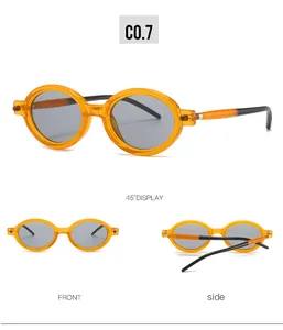 Viste dettagliate degli occhiali da sole ovali vintage con montatura arancione trasparente