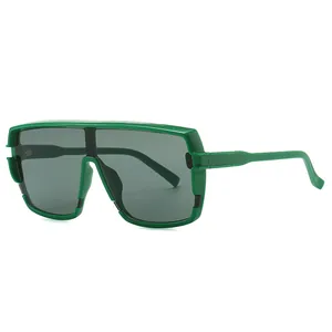 Occhiali da sole oversize con montatura verde brillante e lenti grigio scuro alla moda