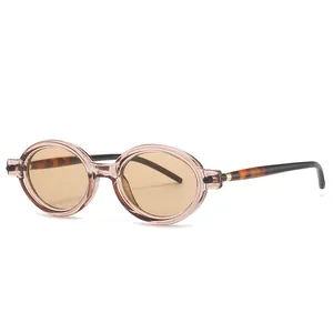 Occhiali da sole ovali retrò con montatura rosa champagne e stanghette tartarugate