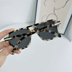 Retro square tortoiseshell sunglasses with dark lenses and stylish silver metal accents