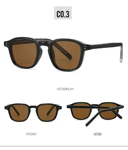 Vues détaillées de lunettes de soleil rétro noires avec verres bruns et rivets métalliques