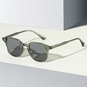Retro jelly green unisex sunglasses with dark gray lenses and silver rivet accents