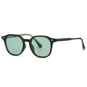 Retro unisex sunglasses with matte black frames and light green tinted lenses