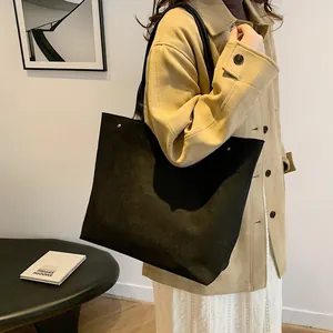 Minimalist black matte suede tote bag with silver studs and long handles for women