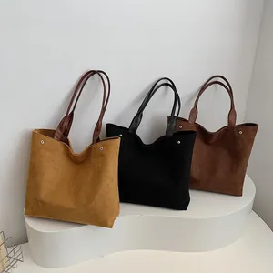 Minimalist faux suede tote bag in brown, black, and coffee for daily commuting style