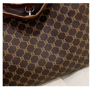 Detail of retro tote bag showing vintage pattern texture and brown leather trim