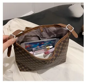 Top view of large capacity dark brown bucket bag interior showing spacious storage