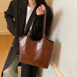 Classic large capacity brown oil wax leather tote bag for women commuting and daily wear