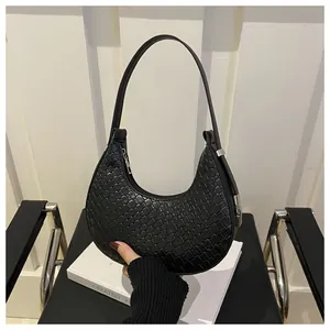 Classic black woven crescent bag with textured leather and silver zipper detail