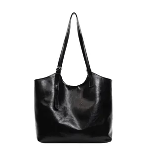 Black glossy oil wax leather tote bag with large capacity and buckled shoulder straps
