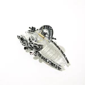 Zebra pattern acetate hair claw clip with crystal clover design on white background