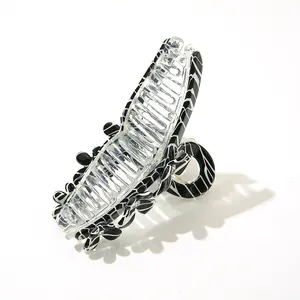Large acetate hair claw clip with zebra stripes and clover crystals for thick hair