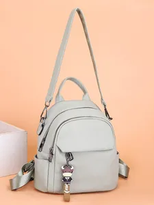 Mini zaino verde chiaro con trama litchi e simpatico ciondolo a forma di mucca da donna