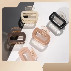 Set of five rectangle acrylic claw clips in beige, black, brown, and pink with glossy finish