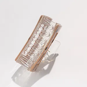 Detail of square hair claw clip in tortoiseshell acrylic with Handmade in France text