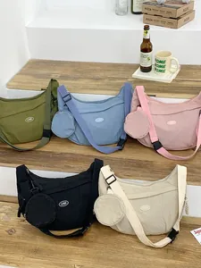 Waterproof nylon crescent crossbody bags in five colors with round mini coin purses