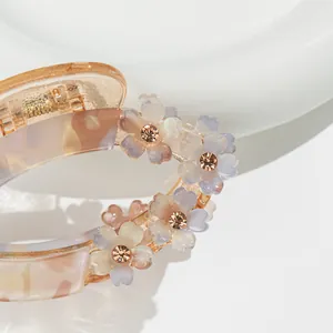 Amber marble hair claw clip with gradient floral decorations and sparkling rhinestones