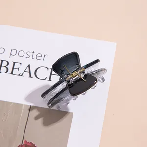 Minimalist black and translucent grey acrylic hair claw clip for elegant hairstyles