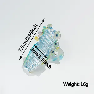 Iridescent clover claw clip with blue flowers and measurement labels for women