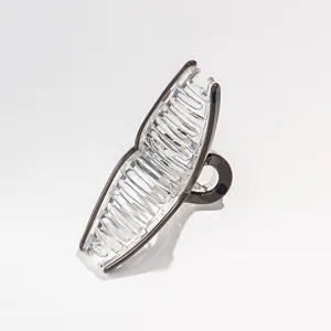 Macro detail of large acrylic hair claw clip with brown edges and sturdy spring mechanism