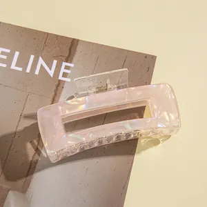 Iridescent pink marble hair claw clip in a large square shape for thick hair styles