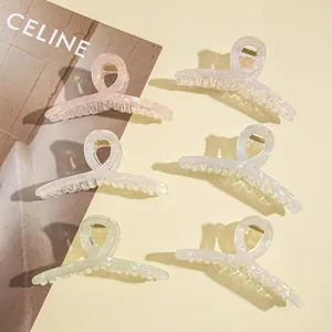 Set of six colorful iridescent acrylic hair claws in pearlescent macaron shades