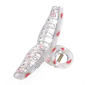 Iridescent acrylic hair claw clip with red watermelon print and metallic spring