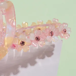 Pince à cheveux en acétate avec fleurs roses et strass pour coiffure élégante
