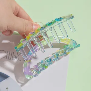 Medium 9cm floral hair claw clip in colorful gradient acrylic with rhinestone accents