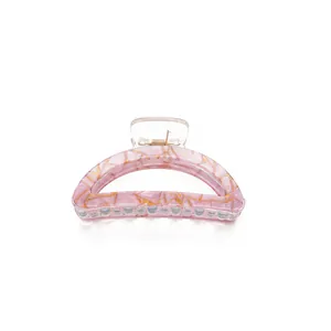Translucent purple resin hair claw clip with golden marble patterns for daily hairstyles