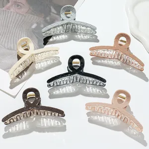 Quilted texture large hair claw clips set in neutral tones for elegant styling