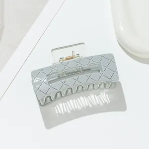 Quilted light blue rectangle hair claw clip with cutout for elegant hair styling