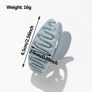 Matte light blue oval hair claw clip 6.5cm size shown with dimensions and weight