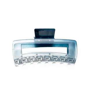 Detail of large rectangular gradient blue hair claw clip with transparent resin teeth