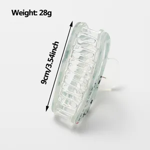 Traditional style semi-circle hair claw clip with light green ink patterns, 9cm length