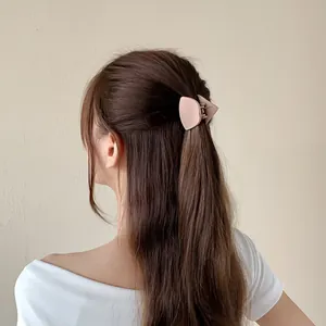 Matte cat ear hair claw clip in soft pink for women, minimalist triangle hair accessory
